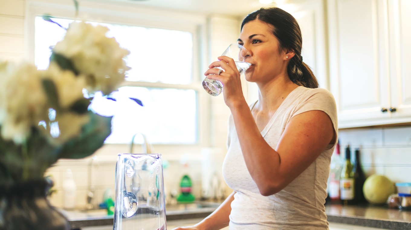 beautiful-young-adult-millennial-female-using-water-in-residential-picture-id1193405665-1.jpg