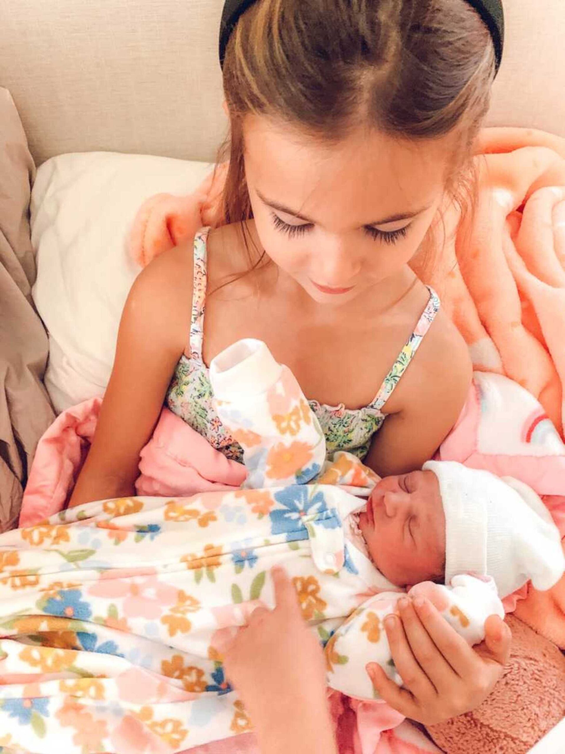 big-sister-holds-little-sister-900x1200-1.jpeg