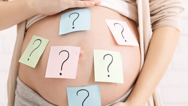 Pregnant belly with Question Post-Its