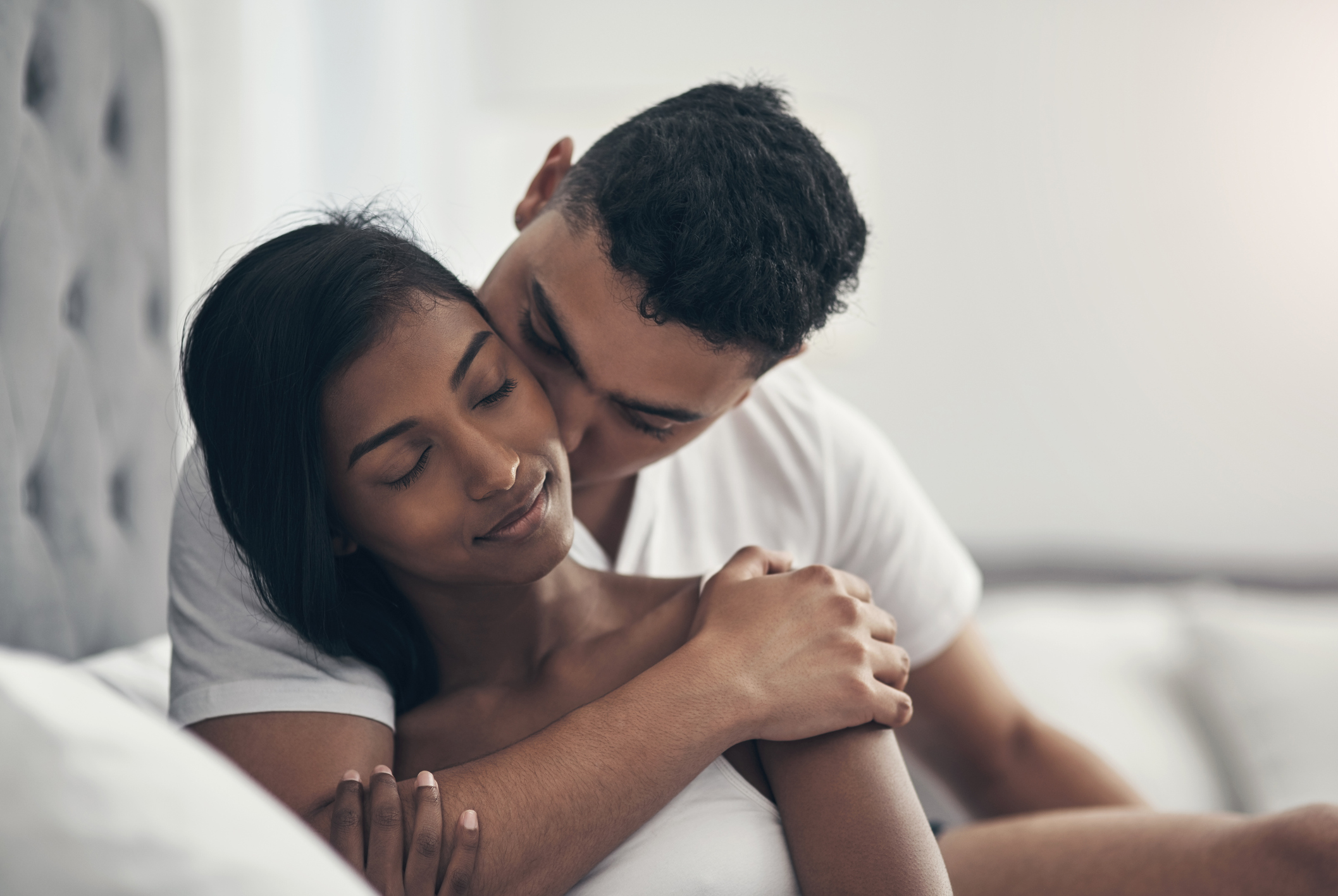 Shot of a young couple sharing an intimate moment at home