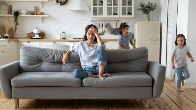 Exhausted Mom with Kids Running Around