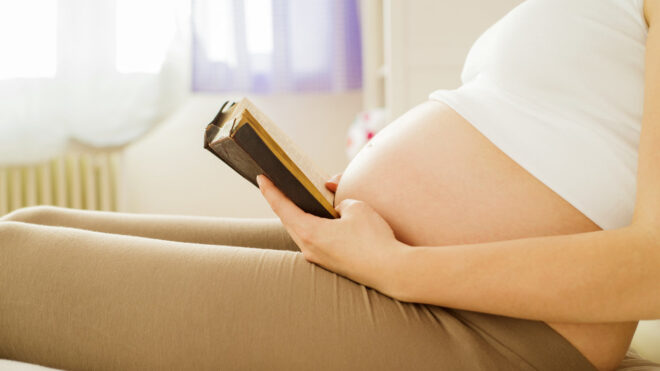 pregnant woman reading bible