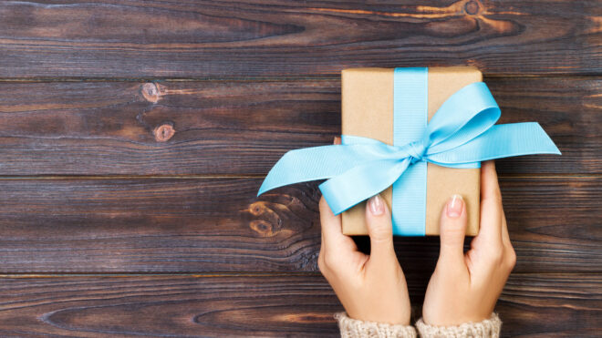 Woman handing a gift
