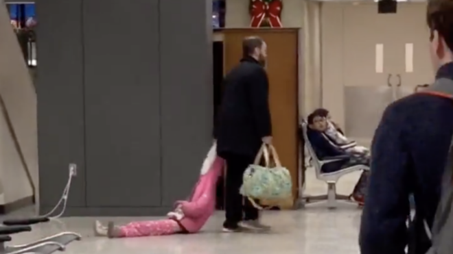 dad drags daughter through the airport