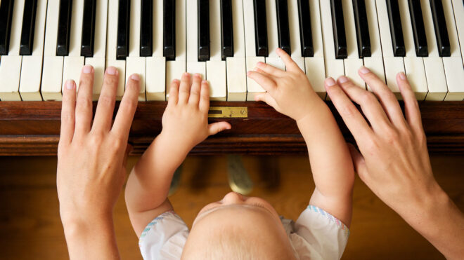 baby playing piano