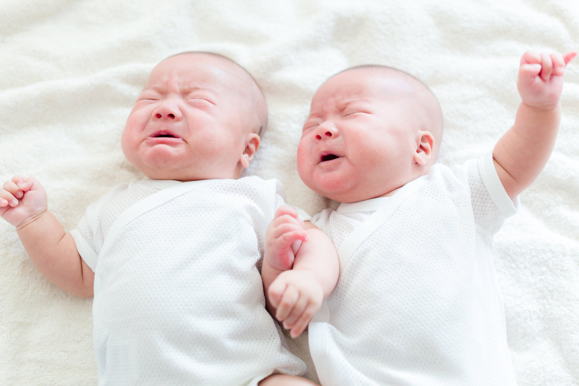 newborn twins crying
