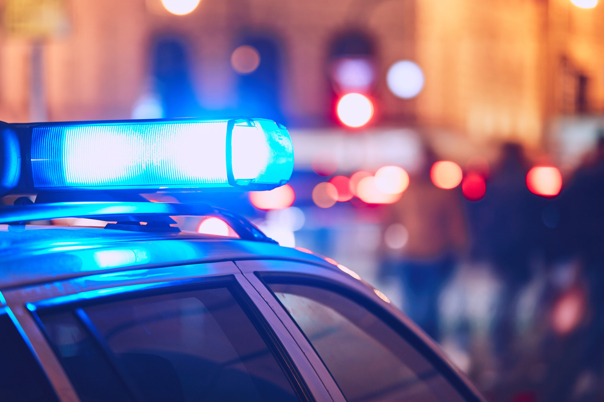 Close-up on the roof of a police car at an accident scene.