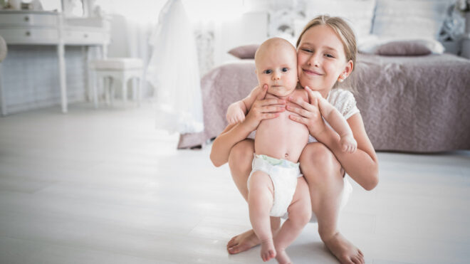 Girl with baby brother