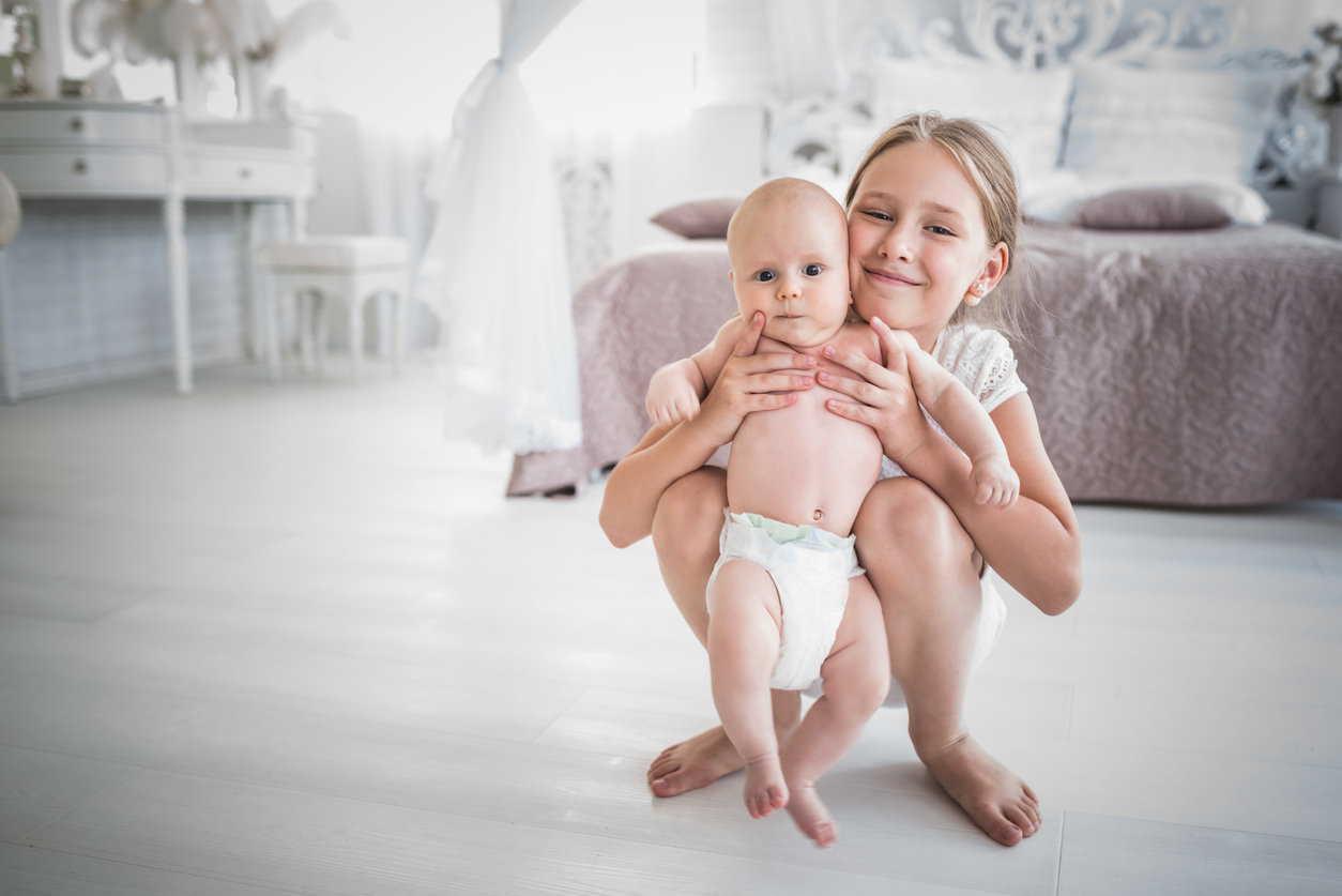 Girl with baby brother