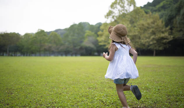 girl running in field