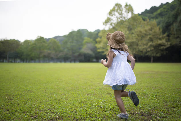 girl running in field
