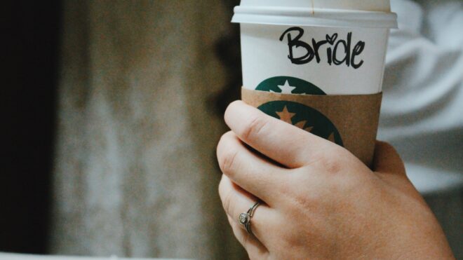 Bride holding starbucks cup
