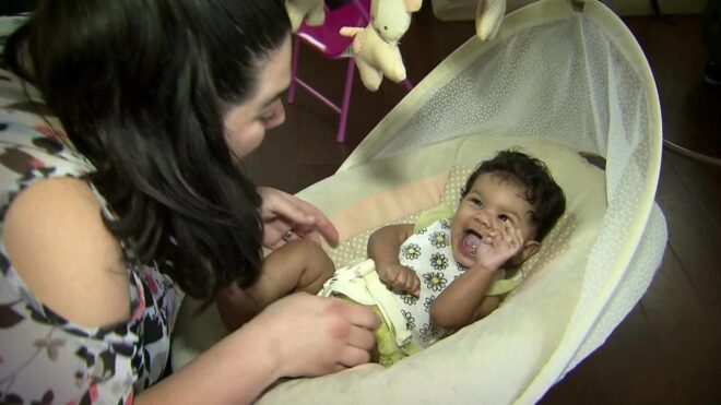 Danielle Bell sits with baby Penelope.