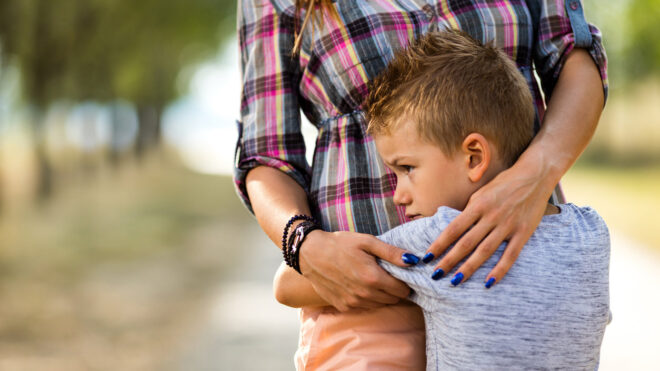 boy hugging mom