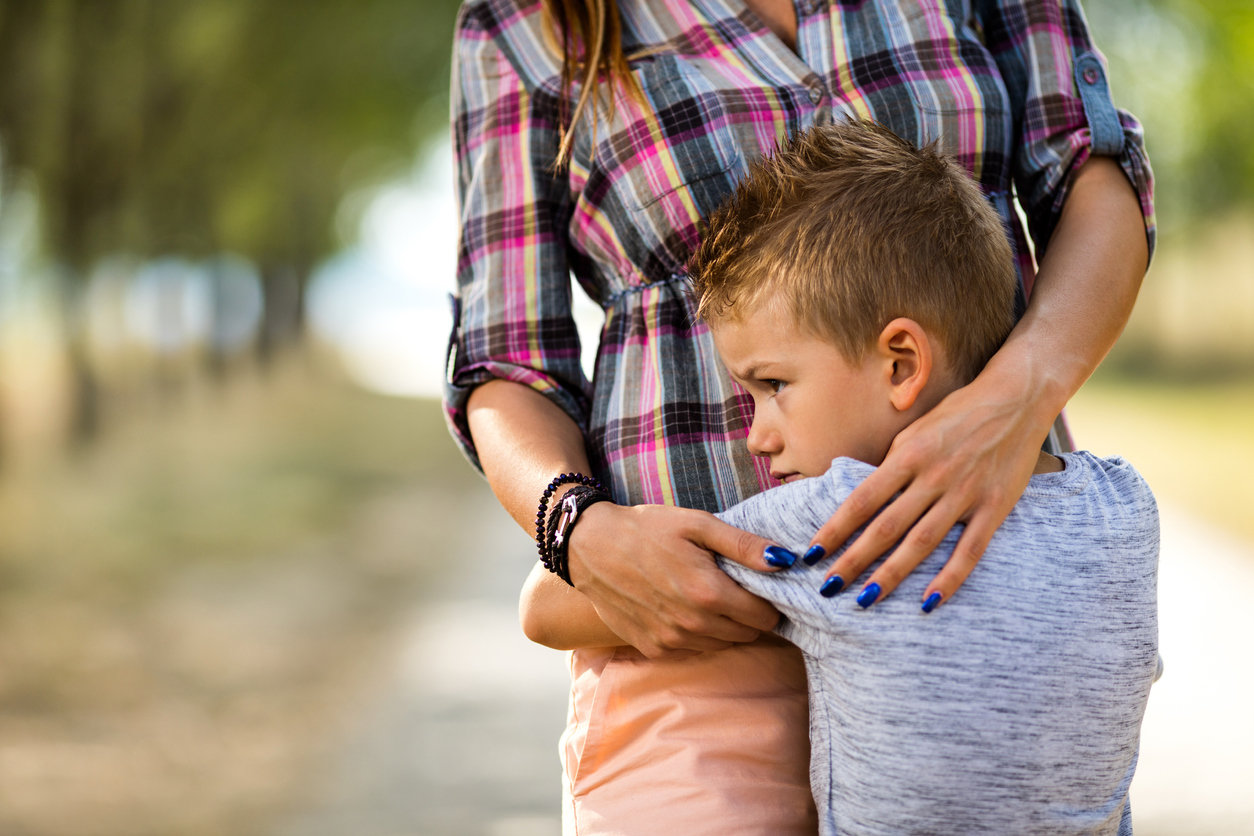 boy hugging mom