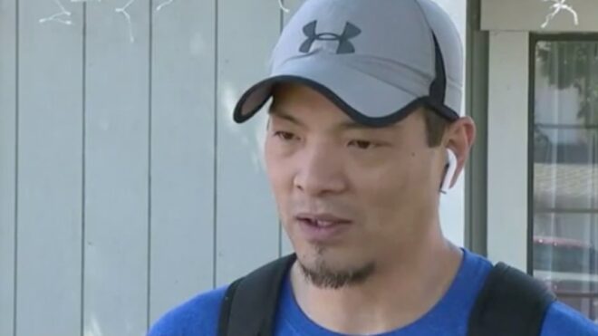 A close-up of Marc Yu speaking with a local news reporter.