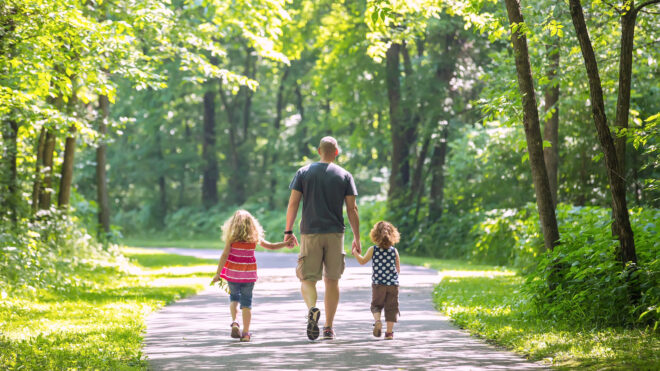 dad walking with kids