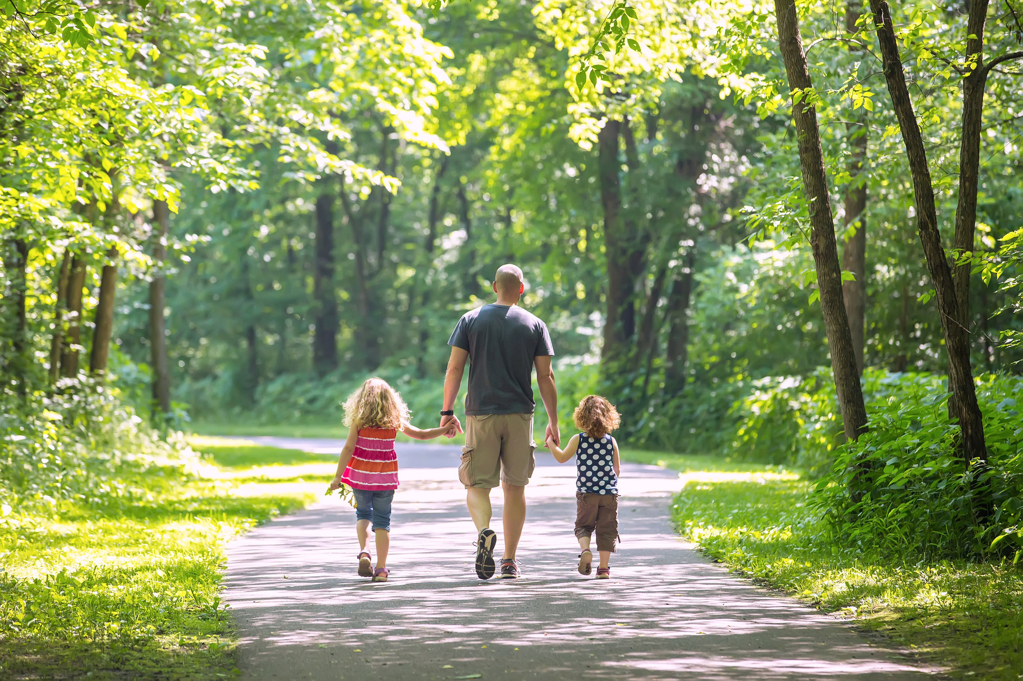 dad walking with kids