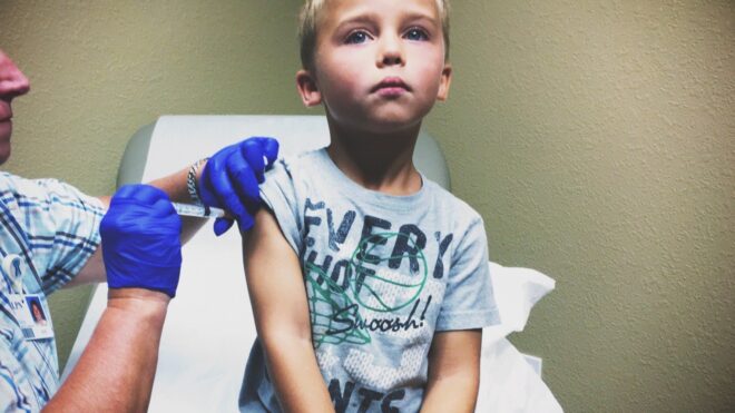 kid getting vaccine