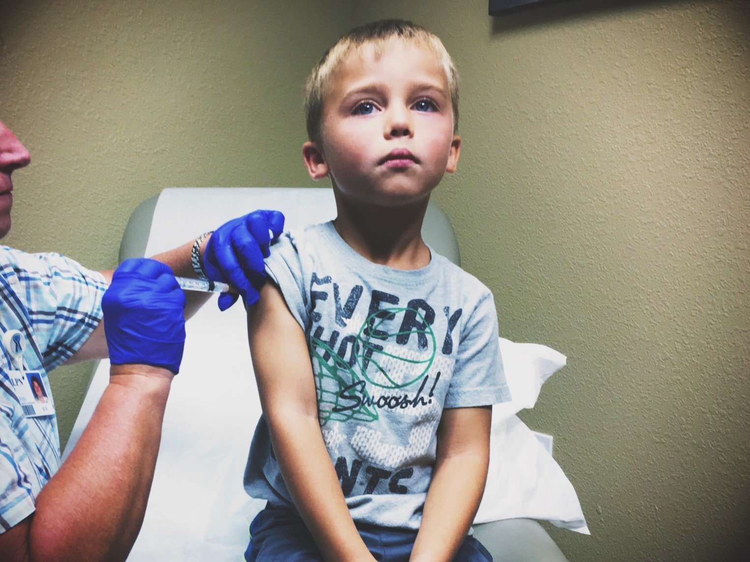 kid getting vaccine