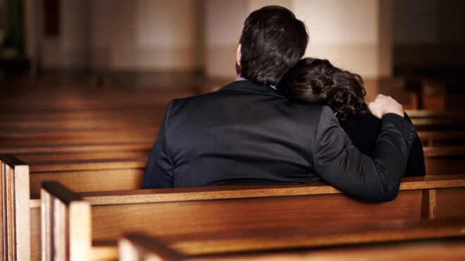 parents at a funeral