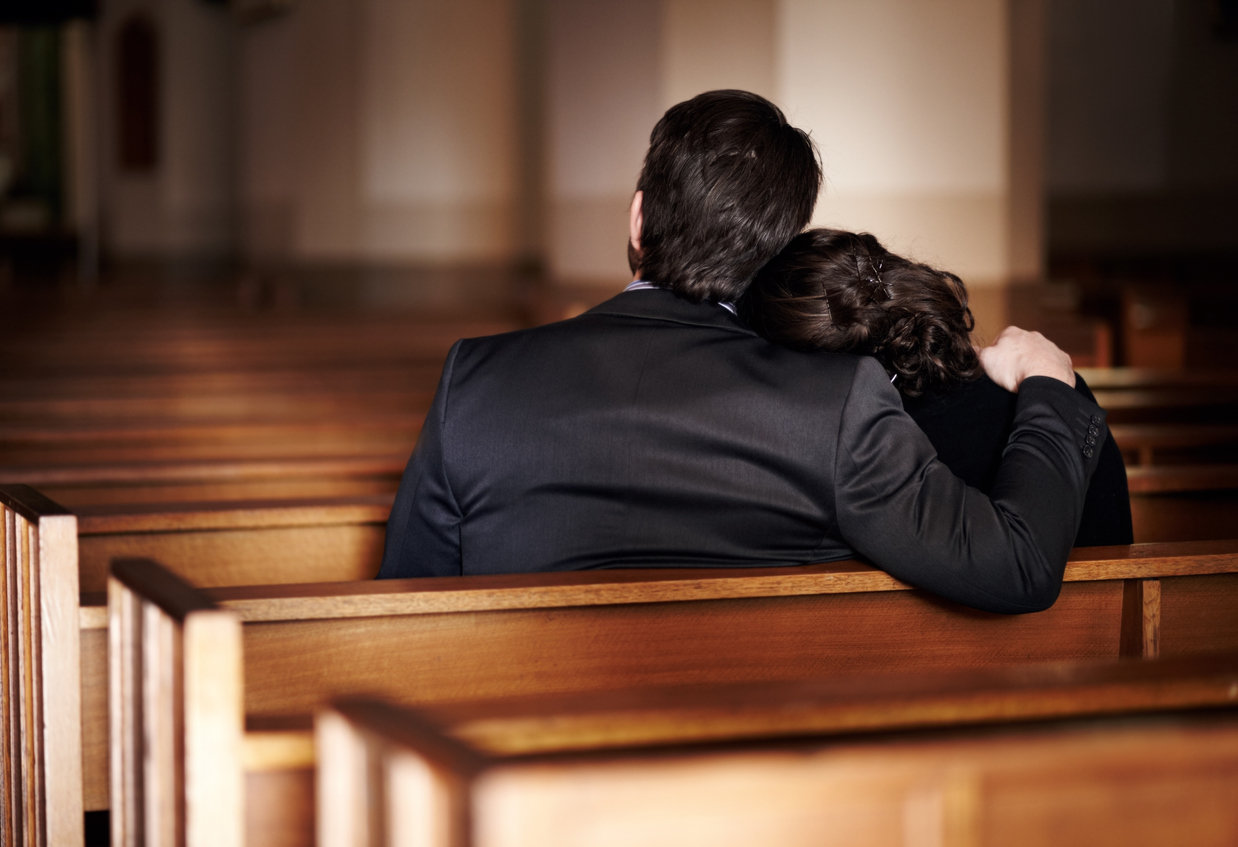 parents at a funeral