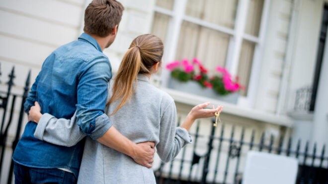 Couple outside of house