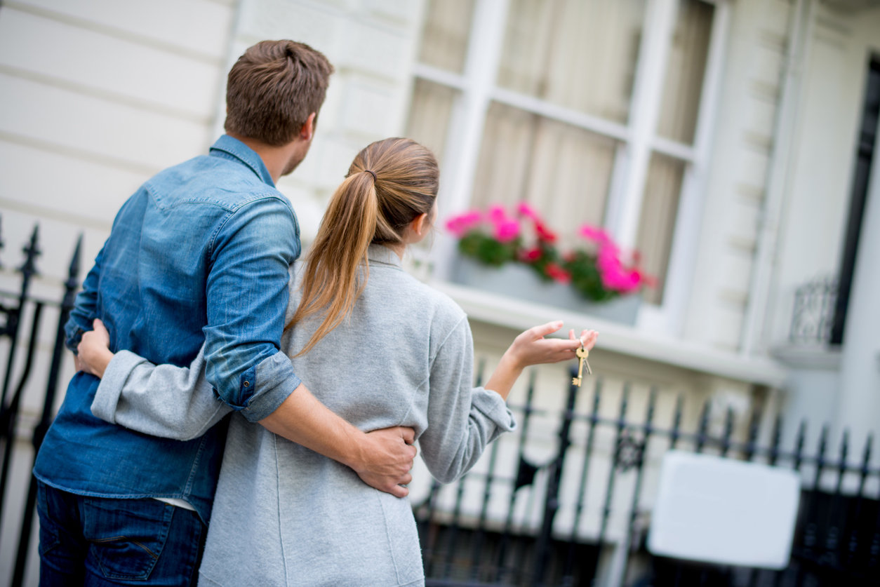 Couple outside of house