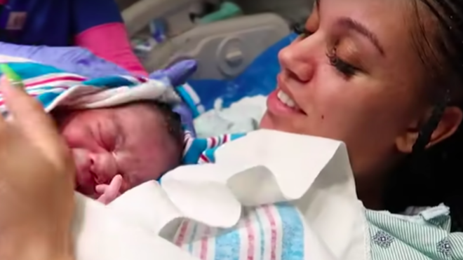 Bianca Prince holds her newborn daughter