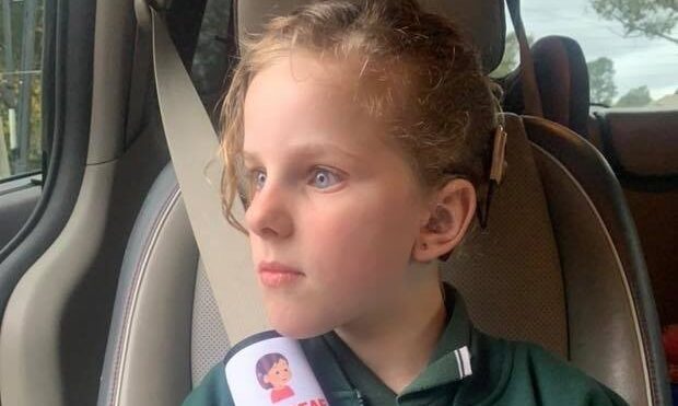 Shae Bell demonstrates the seatbelt cover