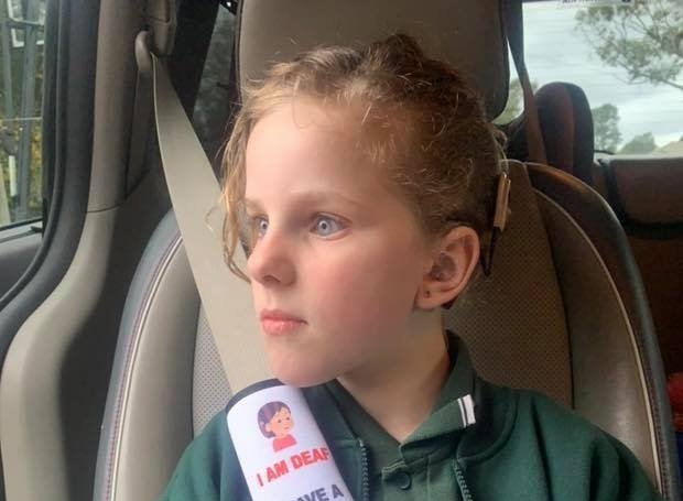 Shae Bell demonstrates the seatbelt cover