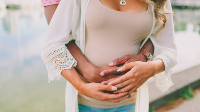 Mom holds baby bump