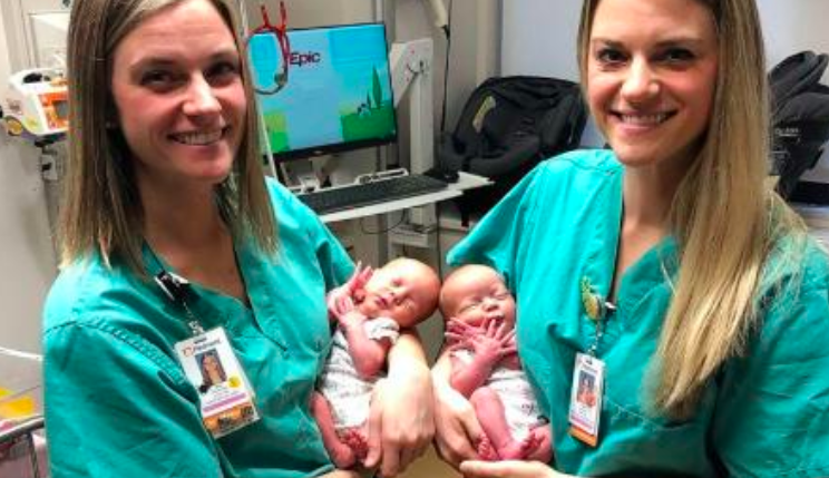 Tori Howard and Tara Drinkard hold baby twins