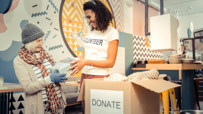 Positive afro American woman giving a nice gift