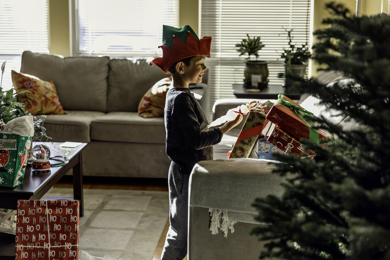 Kid opening Christmas presents
