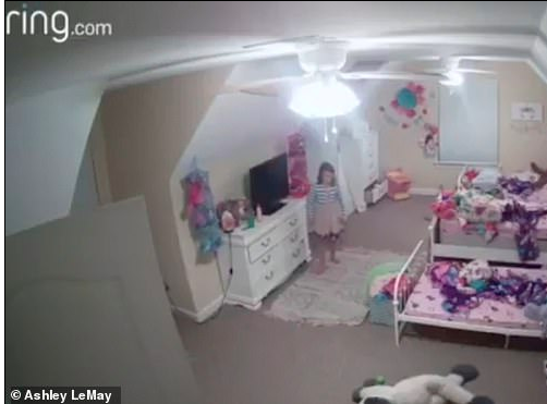 girl standing in bedroom ring camera