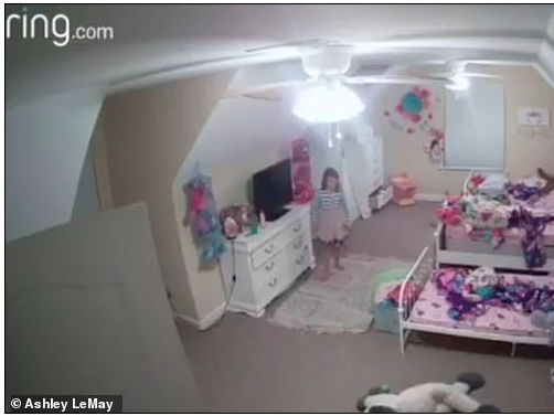 girl standing in bedroom ring camera