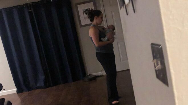 Becca holding Gabrielle Dunn's child