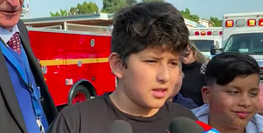 Child speaks with reporters