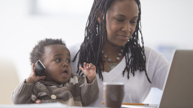 mom budgeting with baby at the table