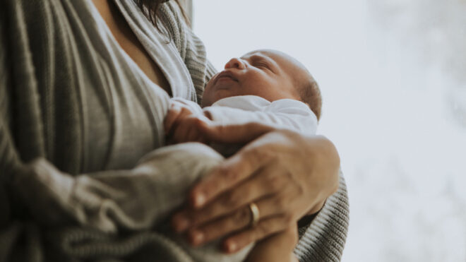 Woman holding newborn