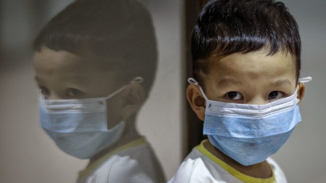 Child wearing a medical face mask