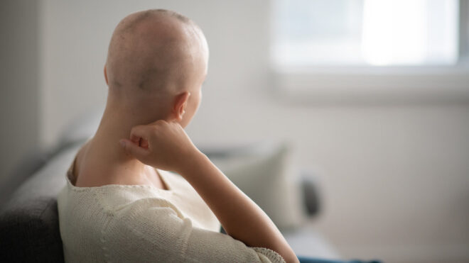 Cancer patient in hospital bed