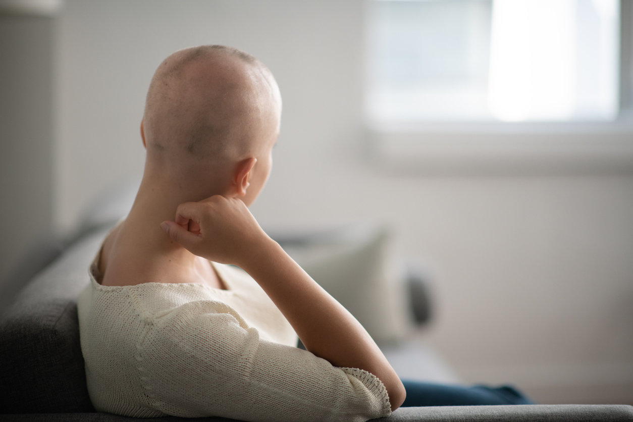 Cancer patient in hospital bed