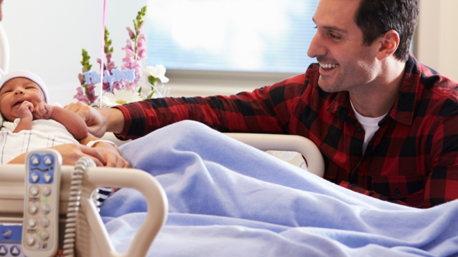 man visiting his wife and new baby