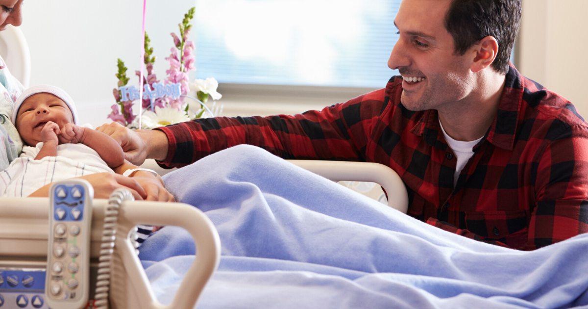 man visiting his wife and new baby