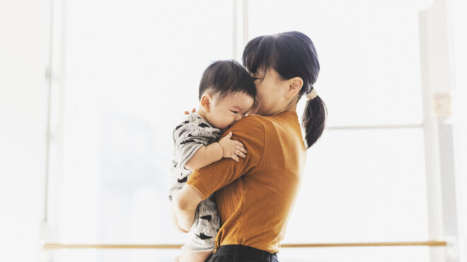mom hugging baby