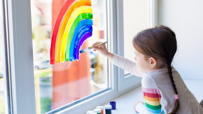 Girl painting rainbow