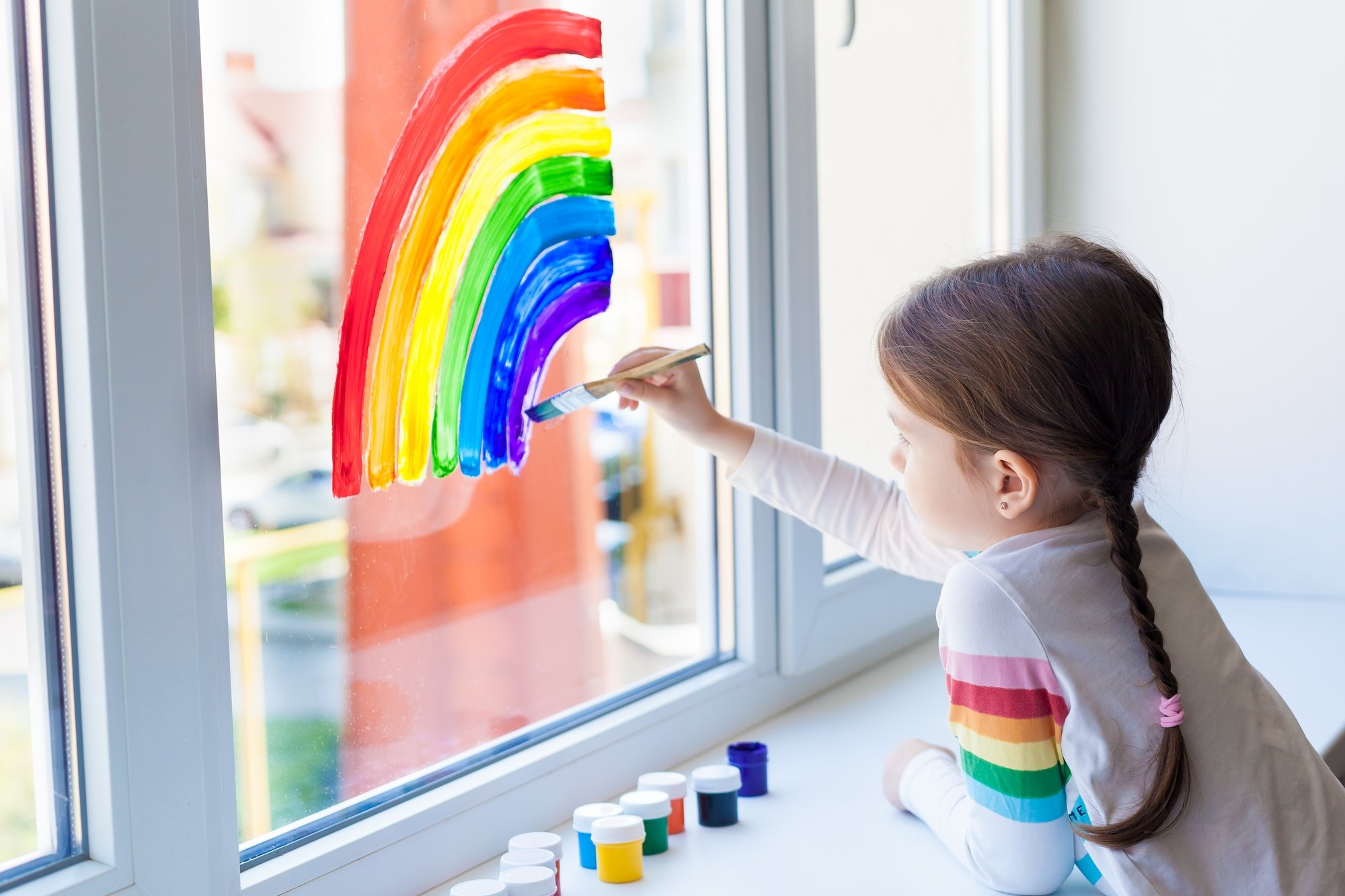 Girl painting rainbow