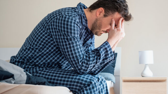 man alone in bed